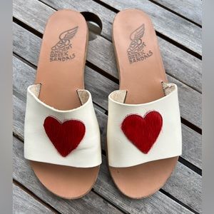 Ancient Greek Sandals in white with a red pony hair heart
